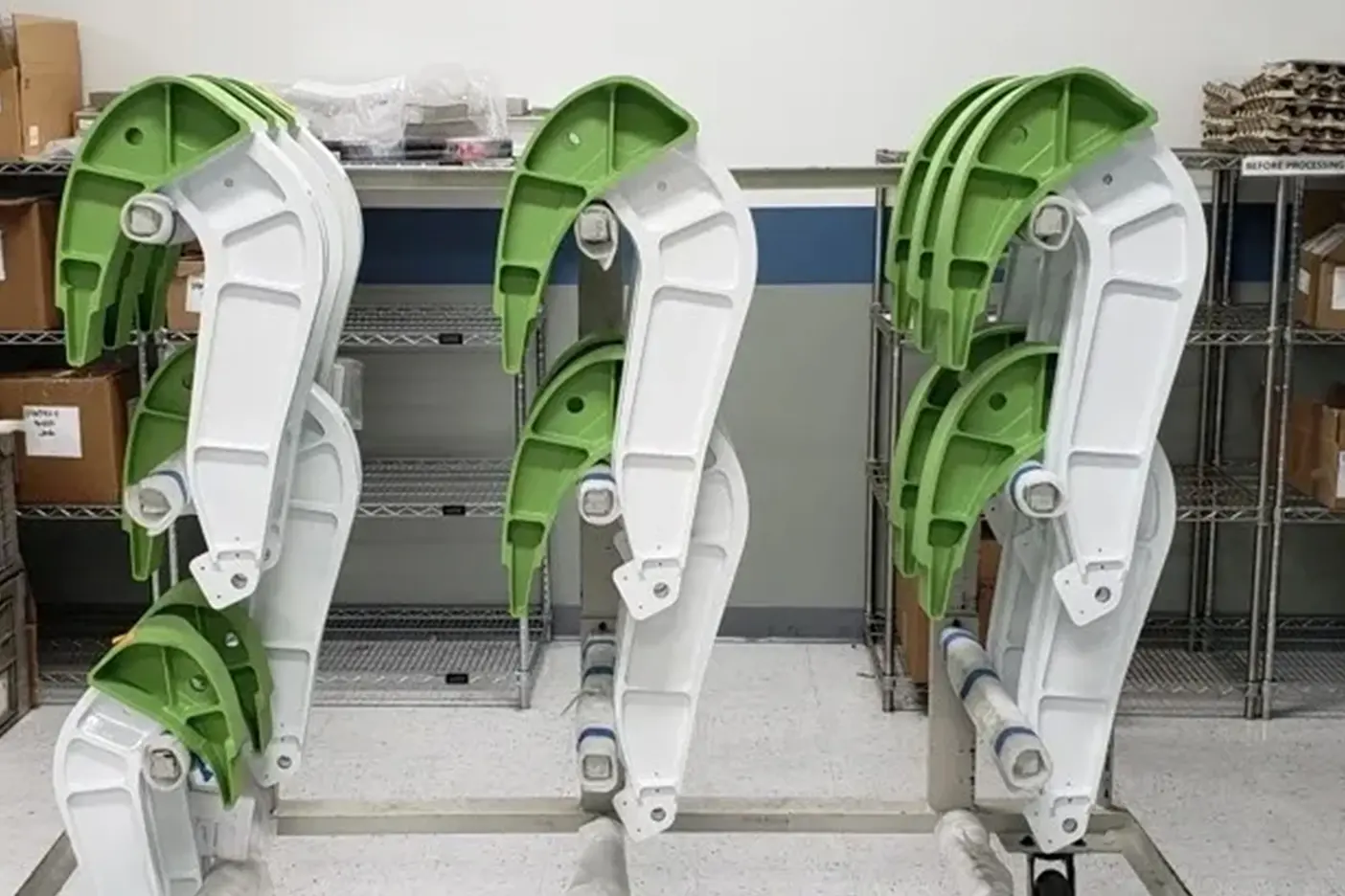 A group of green and white chairs in a room.