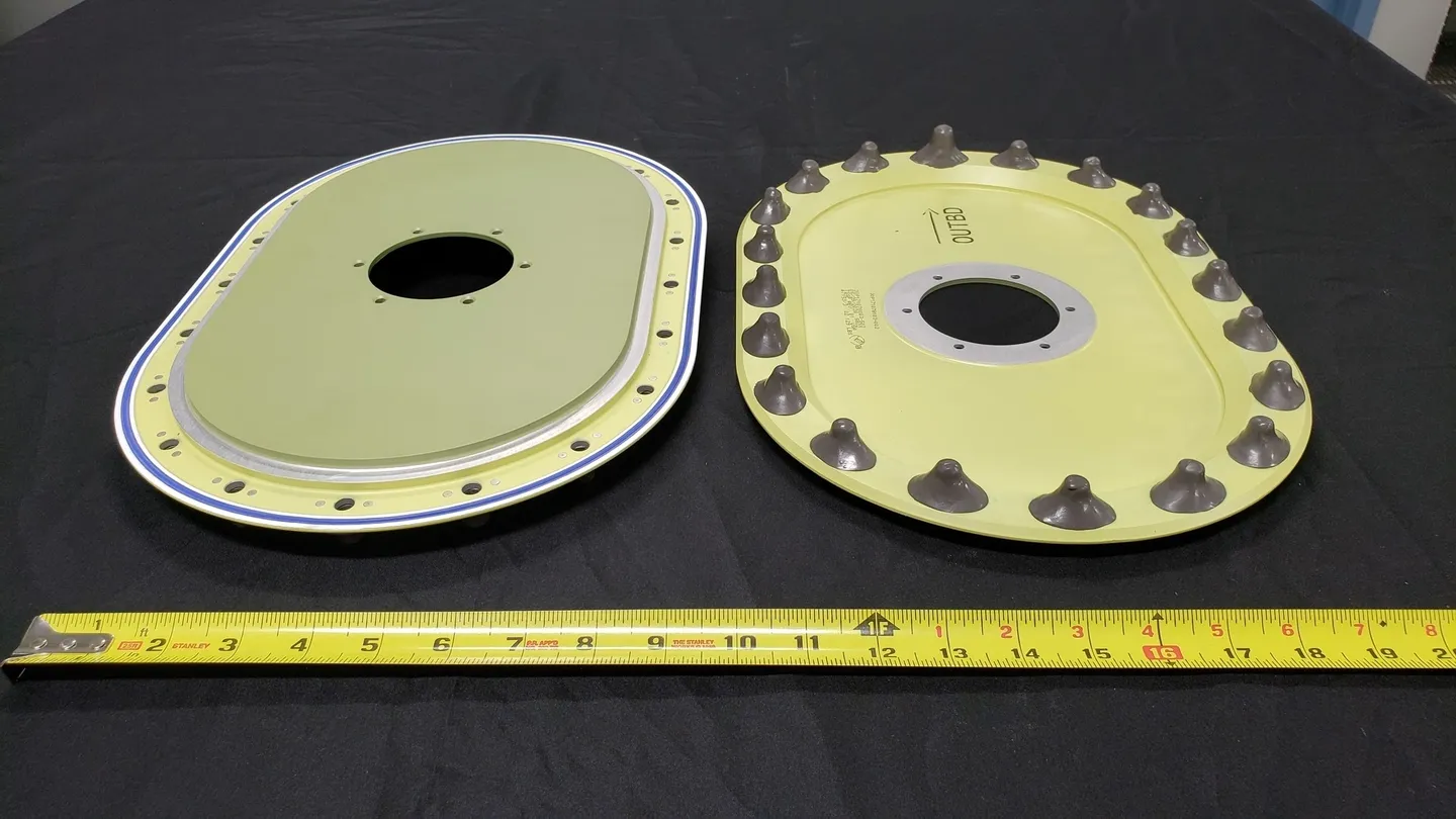 A yellow and black plate with a ruler